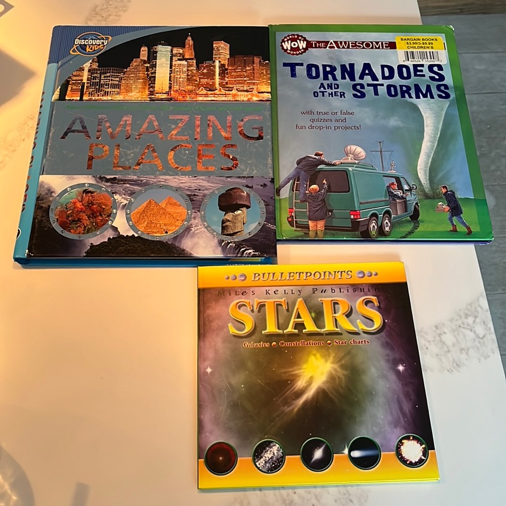 Three hardback books about weather, amazing places, and the sky!